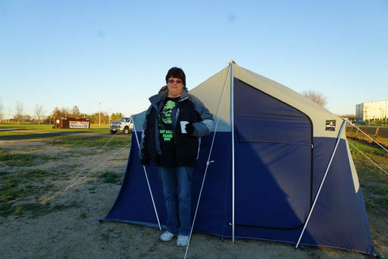 Bonnie Borman standing outside of her tent in Bainport