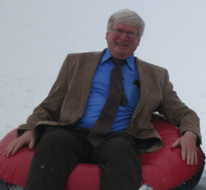 Grothman Snow-Tubing in a Suit