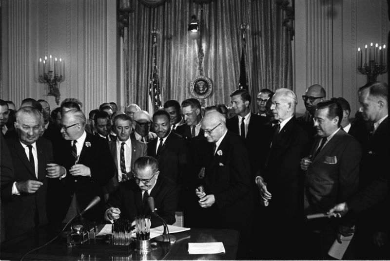 Lyndon Johnson signs the 1964 Civil Rights Act