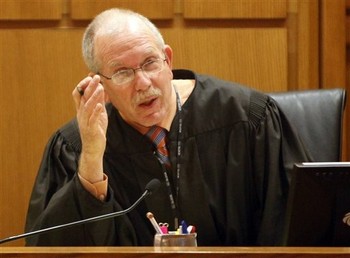 Judge John C. Albert presides over a hearing at the Dane County Courthouse. (Photo courtesy of AP)