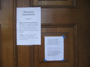 A copy of the Wisconsin Constitutions provisions on open government was posted on the doors of the Capitol when reporters arrived early this morning