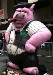 pig dressed as a banker