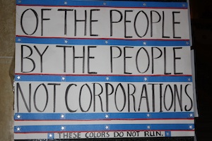 Protest sign: Of the people, by the people, not corporations