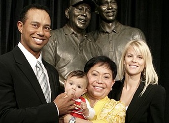 Tiger Woods with his wife, mother, and baby