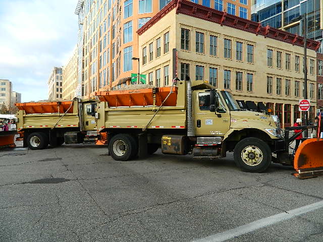 Snow trucks used as security barriers for the final Obama rally.